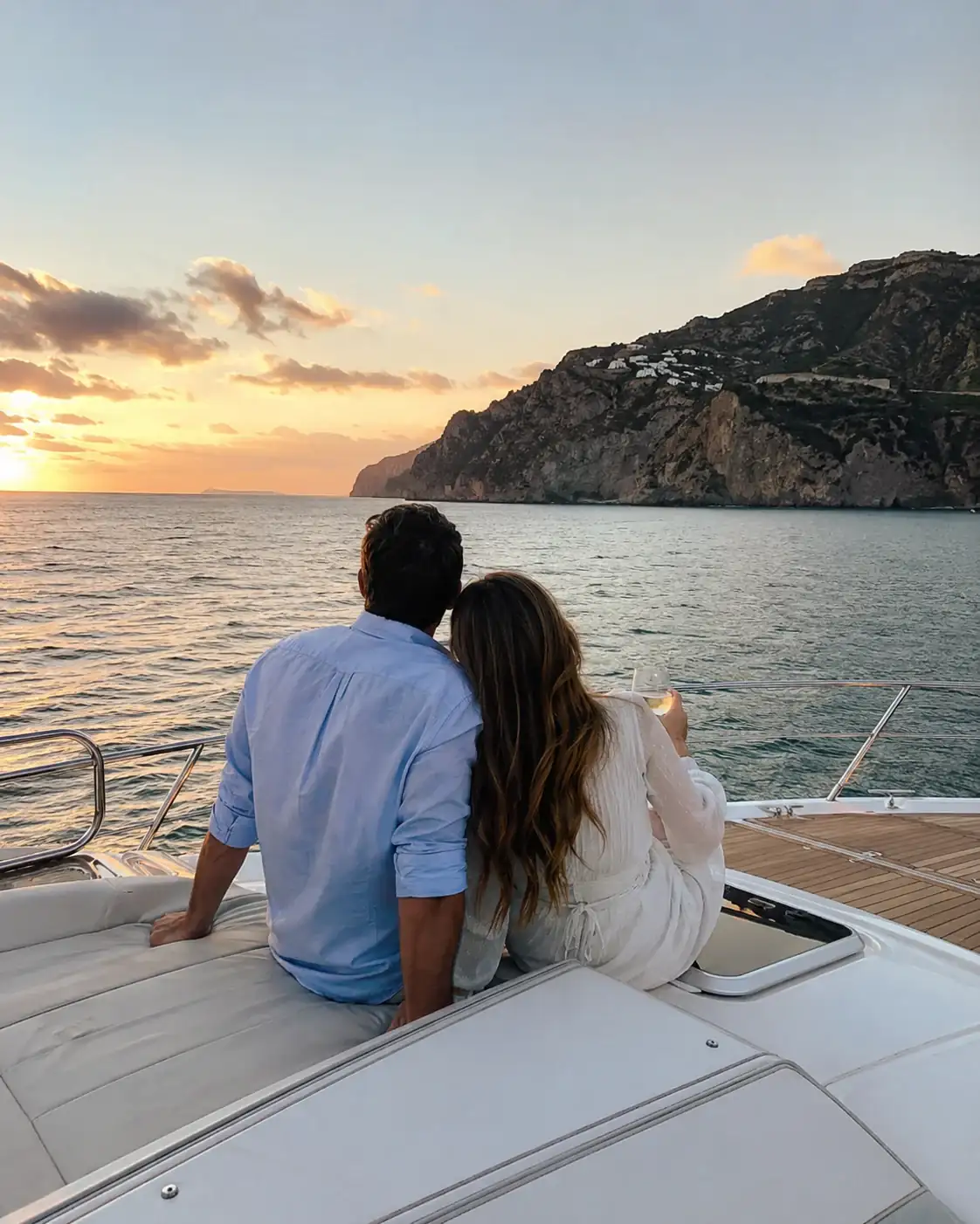 A couple looking toward the coast from a boat